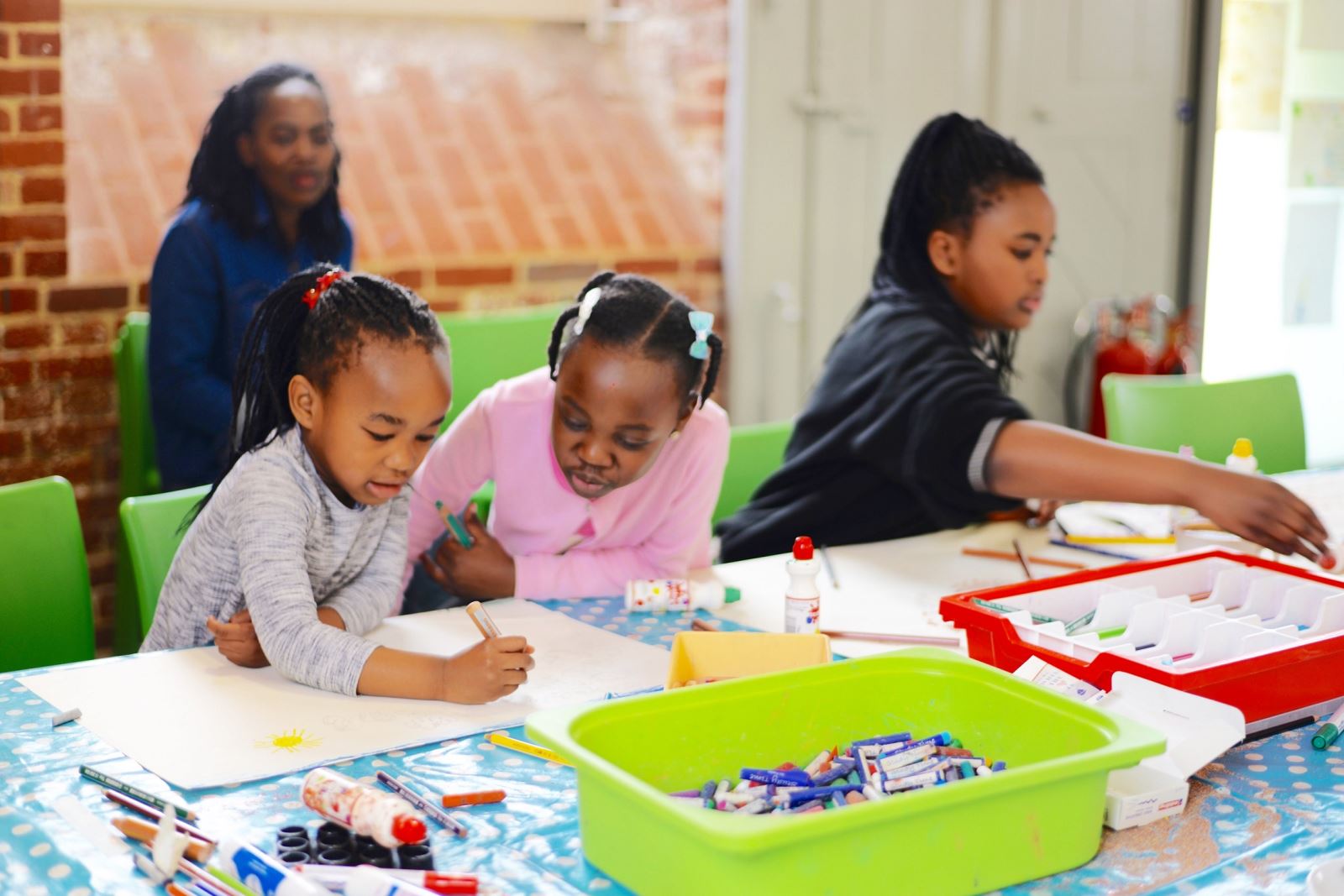 A family taking part in Family Saturday craft activities at Aspex Portsmouth